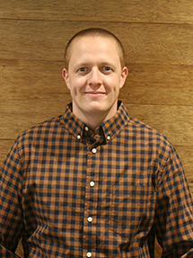 hayes_parnell_287px_high Image of hayes parnell standing in front of a wood wall.